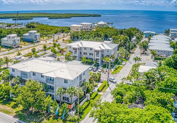 Aerial of Playa Apartments with the ocean in the background