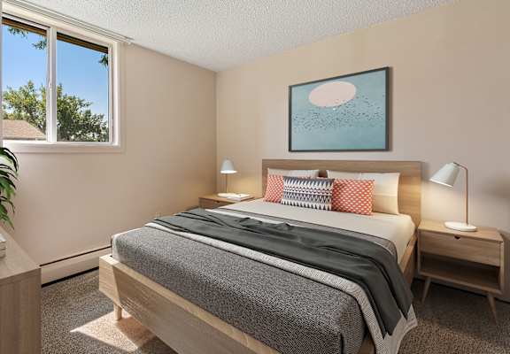 a bedroom with a bed and a window