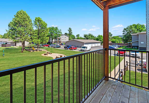 a view of the yard from the balcony of a house