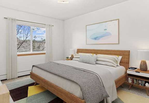 a bedroom with a bed and a window