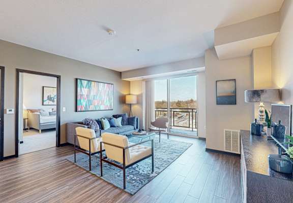 A modern living room with a sofa set and a coffee table.