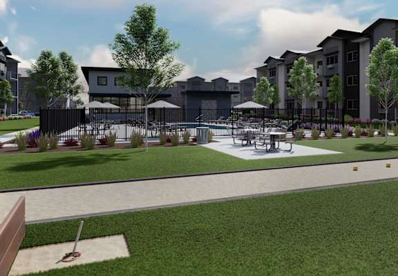 a rendering of a park with tables and chairs in front of an apartment building