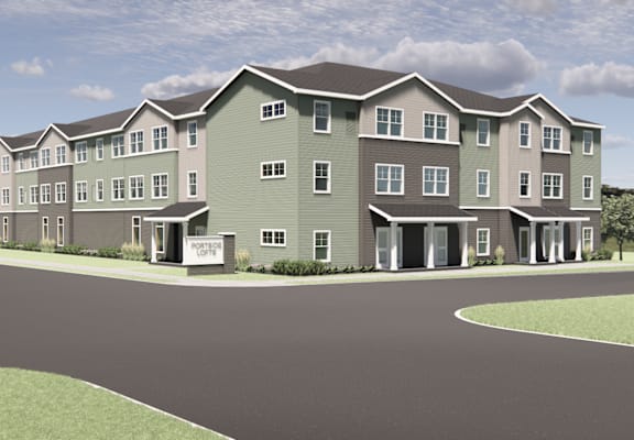 A rendering of a modern apartment complex with a central courtyard.