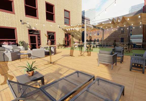 a large patio with tables and chairs and a roof terrace at Lofts at 629, Ohio, 44114