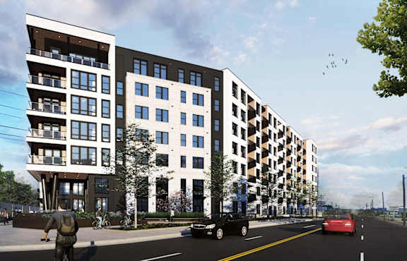 a rendering of an apartment building on a city street