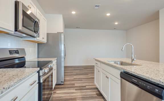 Kitchen with granite counter tops and stainless steel appliances at The Mark, Virginia