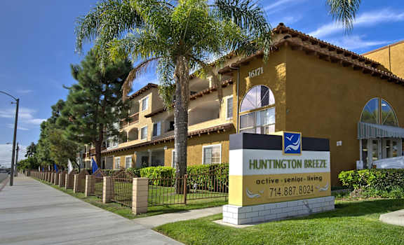 Huntington Breeze senior living community with a clear blue sky.