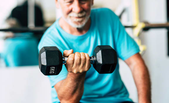 a man lifting weights in a gym