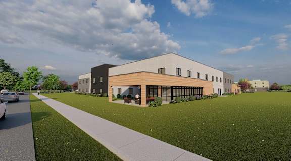 a rendering of a three story building with a sidewalk in front of it