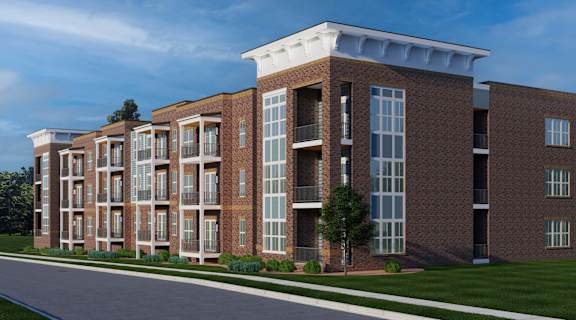 A modern brick building with large windows and balconies.