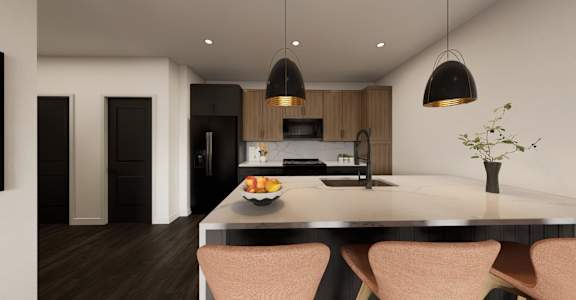 A modern kitchen with a table and chairs.