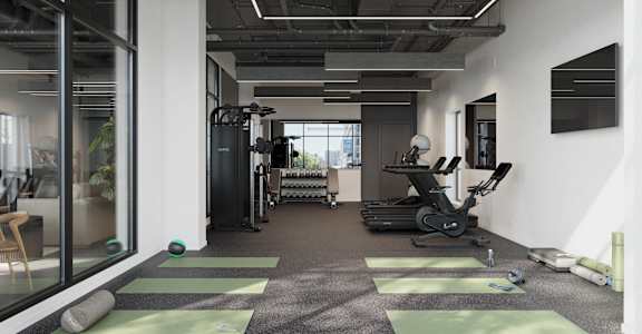 a gym with treadmills and weights in a room with a large window at Skylar At Sunset, California, 90027