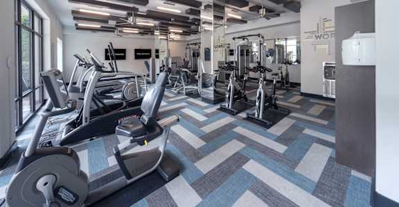 a gym with treadmills and other exercise equipment at The Hendrix, Atlanta, GA, 30329