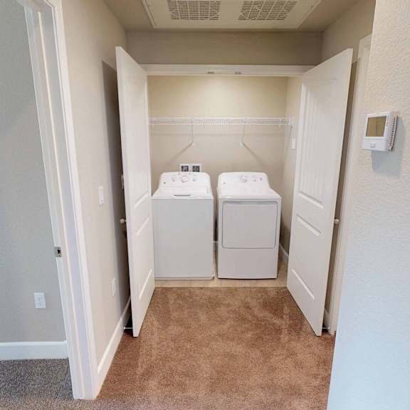 a laundry room with two washers and dryers in it at Edgewater, California, 94565