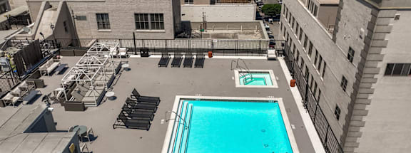 an aerial view of a swimming pool on the roof of a building