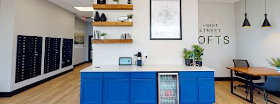 a kitchen with blue cabinets and a counter topat First Street Lofts in Downtown Bismarck, Bismarck, 58506