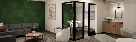 A modern office lounge with a green wall and a variety of seating options.