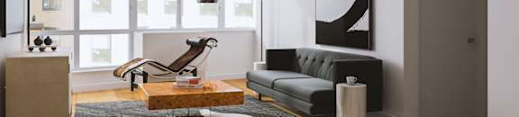 A modern living room with a grey couch, a wooden coffee table, and a large abstract painting on the wall.at 'The Metropolis', New York, NY
