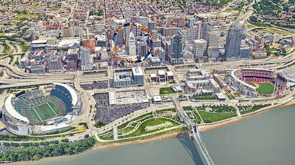 An aerial view of a city with a large stadium and a bridge over a river.at Sky Central, Cincinnati, OH