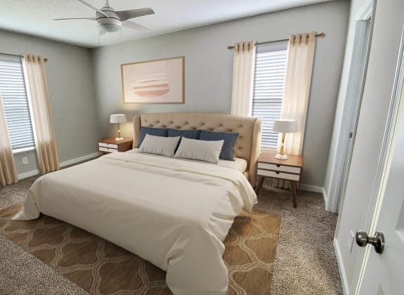a bedroom with a bed and two windows at Planters Trace, Charleston, SC 29414