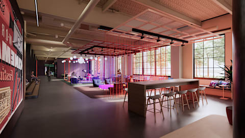 A room with a long table and chairs with a sign on the wall.