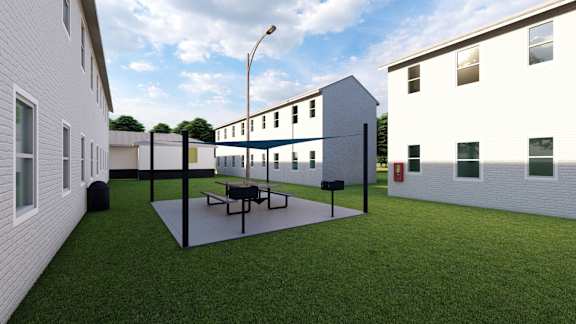 a courtyard between two buildings with a ping pong table