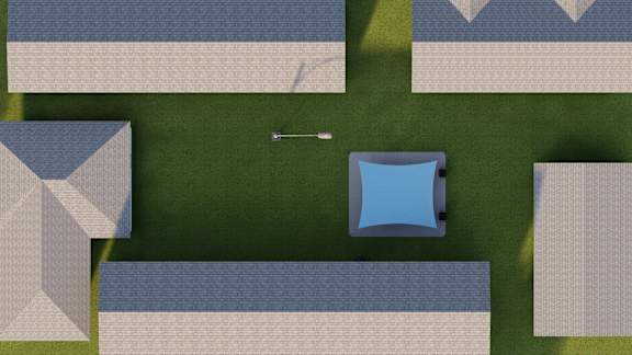 an aerial view of a yard with a blue umbrella