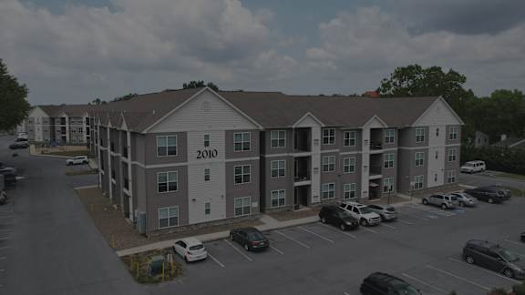 Apartment complex with the year 2010 on the side of the building.