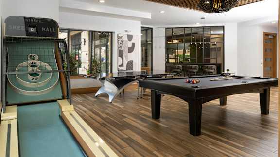 A pool table with a billiard rack on it.