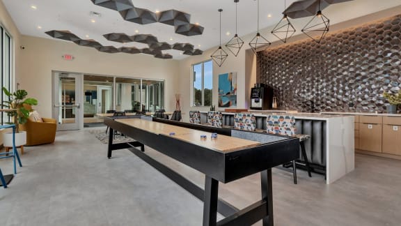 a shuffleboard table in the clubhouse of a house