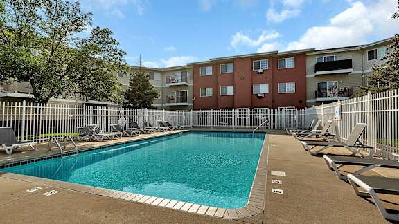 our apartments have a resort style pool with lounge chairs