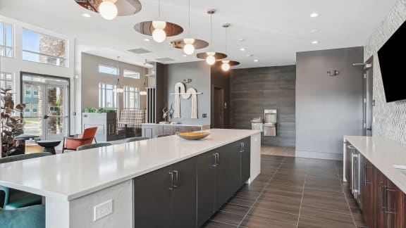 a large kitchen with an island in the middle of it