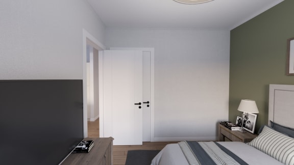 a bedroom with a bed and desk in a room
