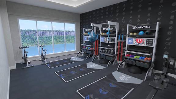 a workout room with weights and a large window
