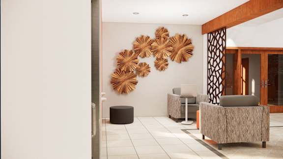 A room with a large wall art and a sofa.