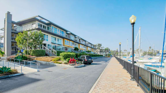 A street view of a residential area with a car parked on the side of the road. at Marina Harbor, Marina del Rey, CA, 90292