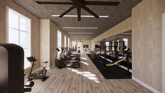 a fitness center with treadmills and other exercise equipment in a room with windows