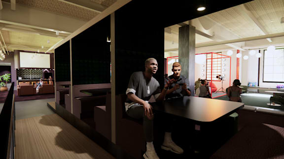 A group of people are sitting in a modern room. at University Commons in Pittsburgh, PA