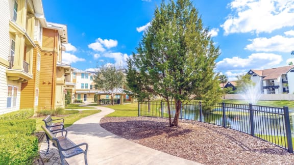 the preserve at ballantyne commons courtyard with benches and a pond