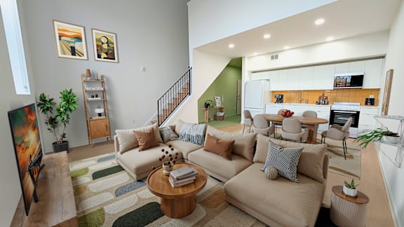 A living room with a couch, a coffee table, and a painting on the wall.