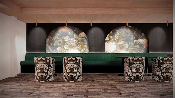A room with a green sofa and a table with a floral design.