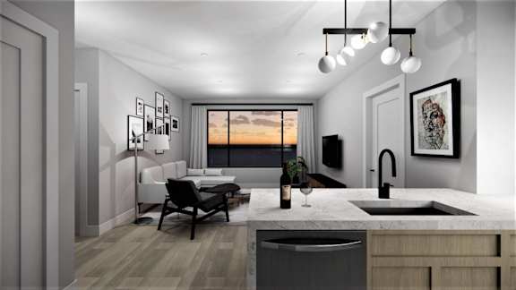 A modern kitchen with a dining table and chairs.