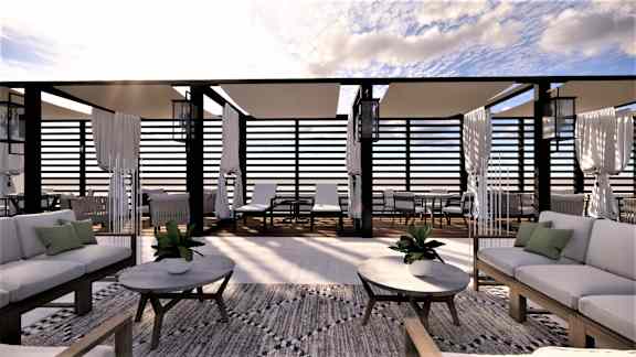 A modern outdoor seating area with white furniture and black railings.