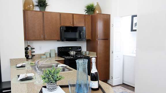 A view of the Kitchen in the 1200 Acqua model apartment home