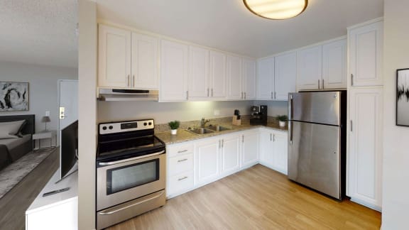 Modern Kitchen with Stainless Steel Appliances at Chateau La Fayette Apartments in Koreatown, Los Angeles
