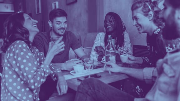 a group of people sitting around a table