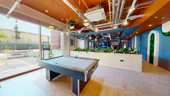 a game room with a pool table