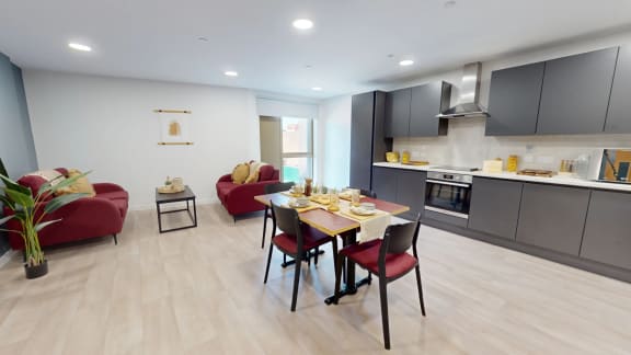 a dining room and kitchen with a table and chairs