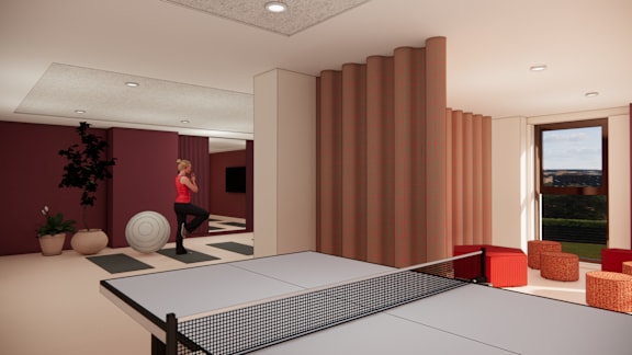 A gym with wooden floors and benches with lockers on the side.
