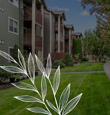 a view of a sidewalk in front of an apartment building